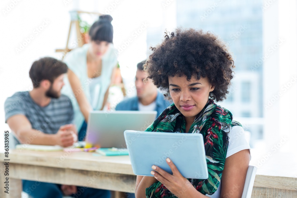 Smiling young women using digital tablet Smiling young women using digital tablet
