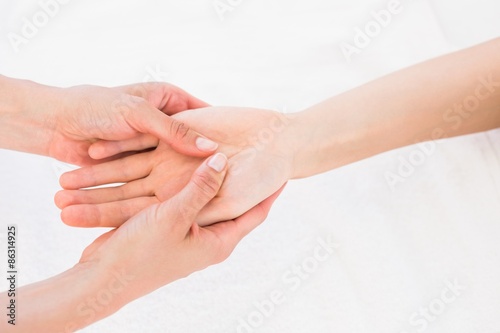  Physiotherapist doing hand massage