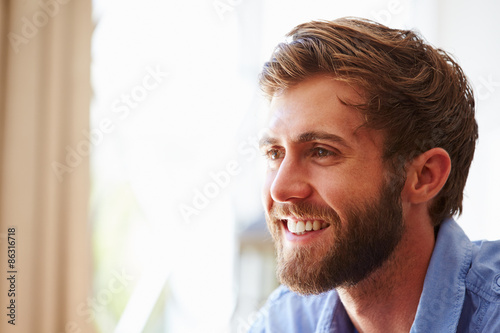 Portrait ofÿa young man smiling