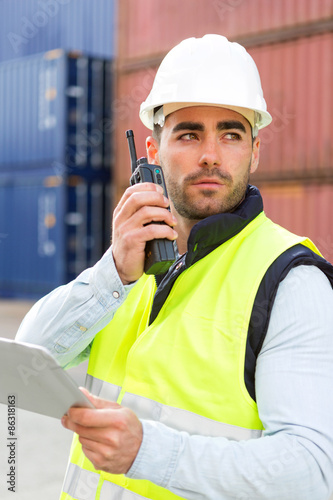 Photos Young Attractive docker using tablet at work