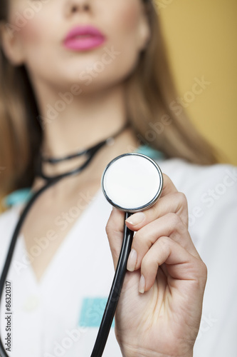 Young nurse with stethoscope photo