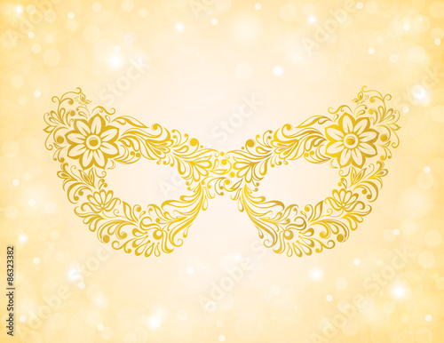 beautiful silhouette golden mask on the background sparkles and bokeh