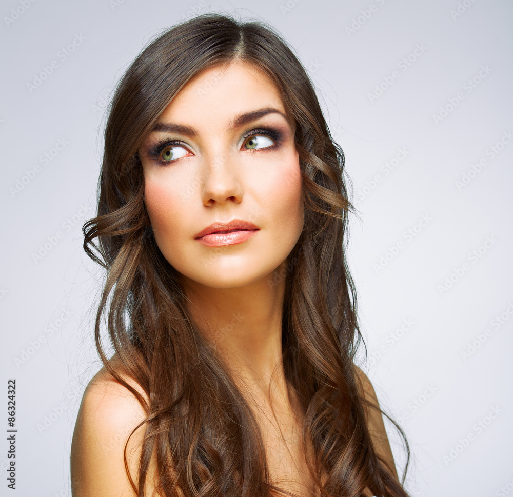 Woman face close up beauty portrait. Girl with long hair lookin Woman face close up beauty portrait. Girl with long hair lookin