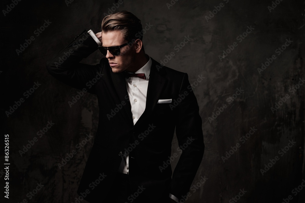Fototapeta premium Tough sharp dressed man in black suit