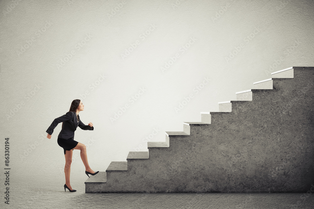woman in formal wear walking up stairs woman in formal wear walking up stairs
