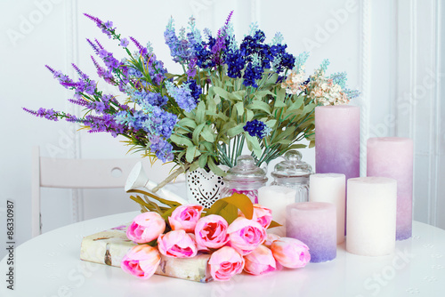 Fototapeta Naklejka Na Ścianę i Meble -  Still life of lavender flower tulips, candles and a book