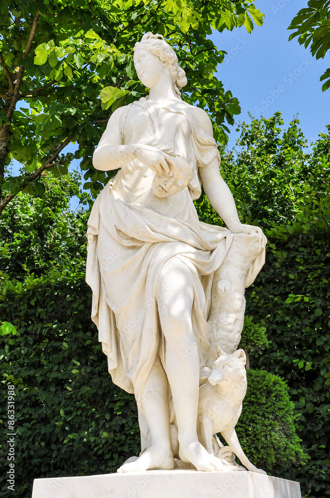 Statue of woman holding mask at Versailles Palace, Paris