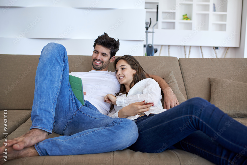 couple at modern home using tablet computer couple at modern home using tablet computer