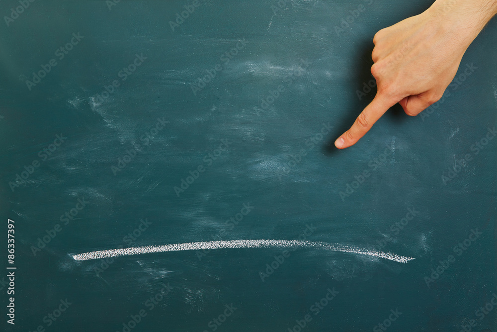 Hand pointing to white line on chalkboard Stock Photo | Adobe Stock