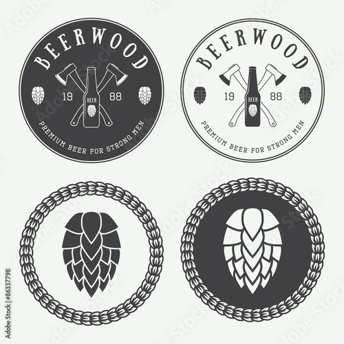Set of vintage beer and pub logos, labels and emblems with bottles, hops, axes and wheat