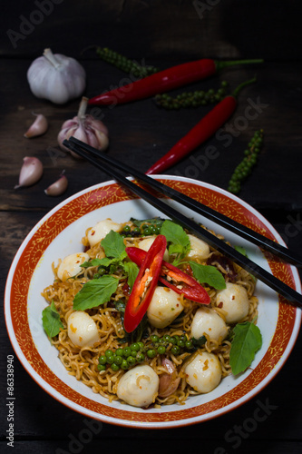 Instant noodle fried with spicy sauce and fish ball