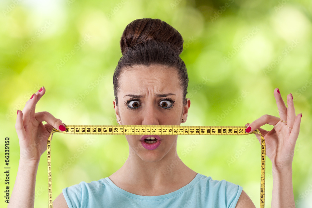 Photo Art Print expression girl with tape measure concept of losing weight carballo