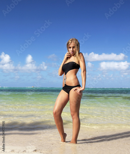 Woman in bikini on caribbean beach