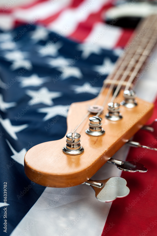 Vintage Bass guitar body on american flag background. selective focus