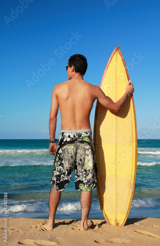 Surfer holding a surf board