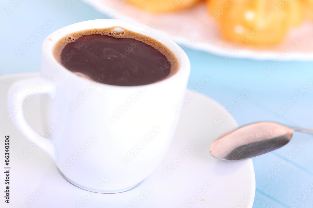 Cup of coffee on blue mat Cup of coffee on blue mat