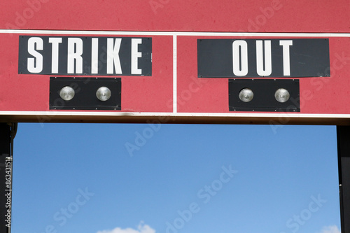 Photography The words strike and out on a baseball scoreboard in New Mexico