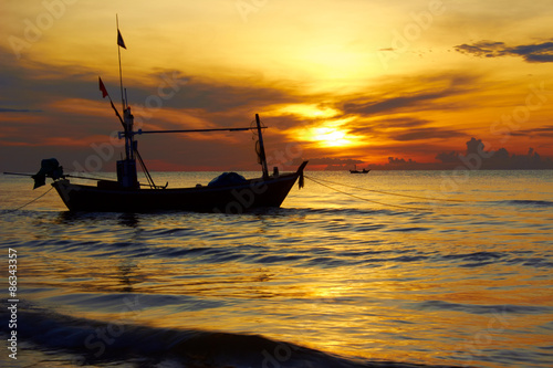 Boat with sea scape in the start of sunrise.