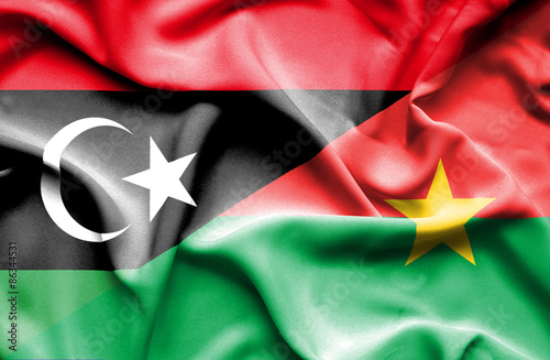 Waving flag of Burkina Faso and Libya