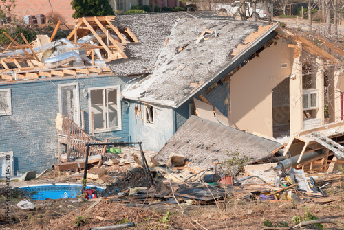 Aftermath of a tornado damaged wood framed house
