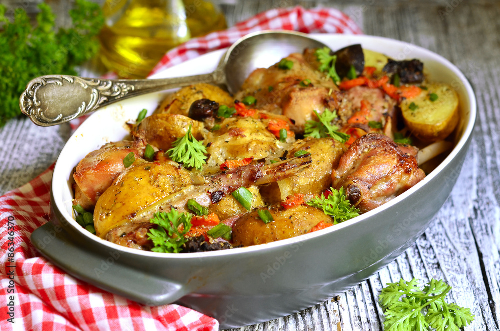 Rabbit baked with young potato in a cream. Rabbit baked with young potato in a cream.