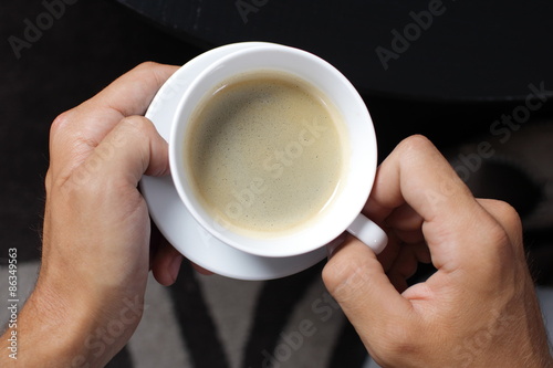 cup of coffee in the hands