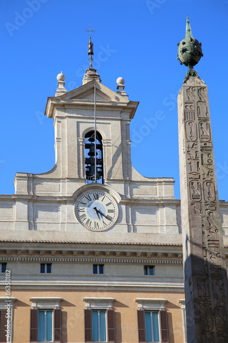 Obelisk of Montecitorio and Italian parliament on Piazza di Mont photo