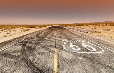 Acrylglasbilder Route 66 Route 66 pavement sign sunrise in California's Mojave desert.  © donvictori0