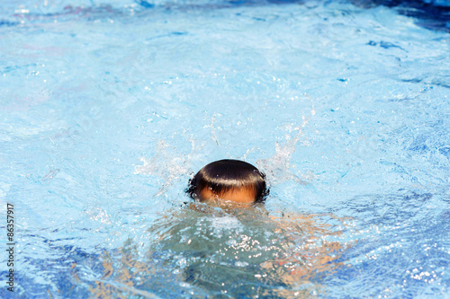 Boy play in the pool