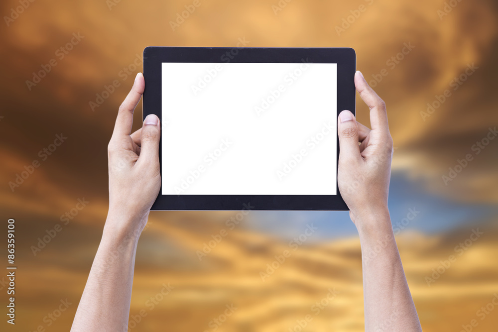 Hand Hold Mobile tablet isolate screen with sky sunset Background.