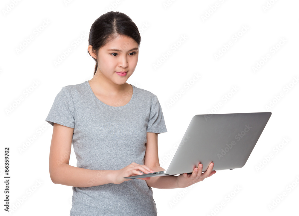 Asian young woman use of the notebook computer Asian young woman use of the notebook computer