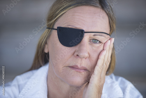 Tablou canvas Tired woman with eye patch portrait