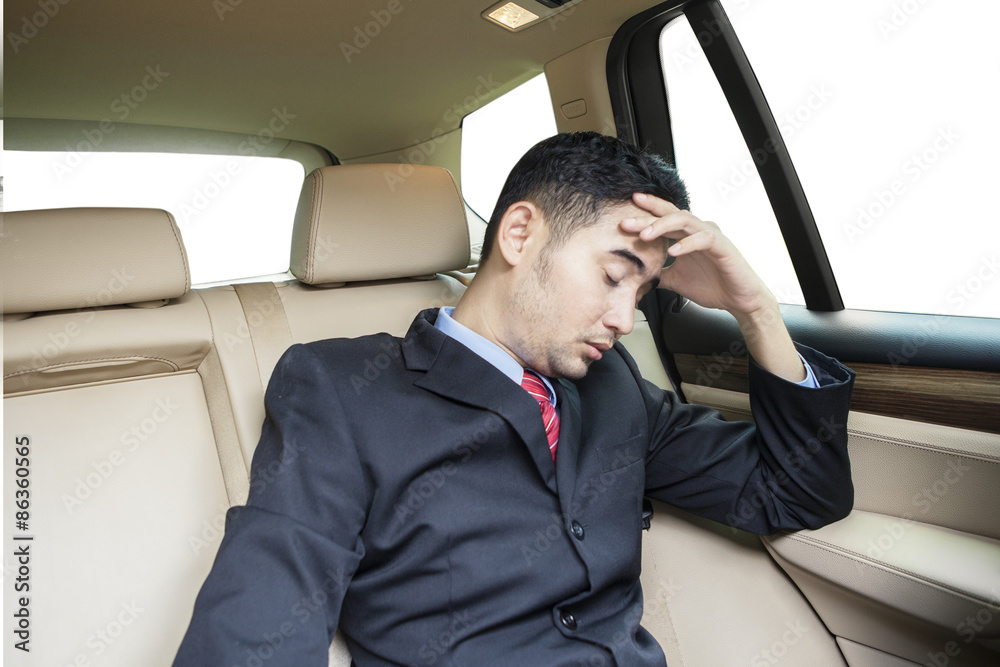 Stressful worker sitting inside car