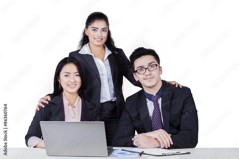Three businesspeople looking at the camera isolated Three businesspeople looking at the camera isolated