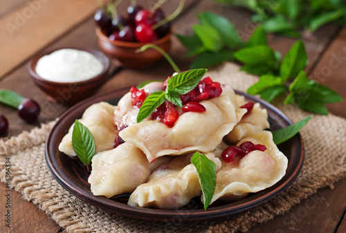 Delicious dumplings with cherries and jam