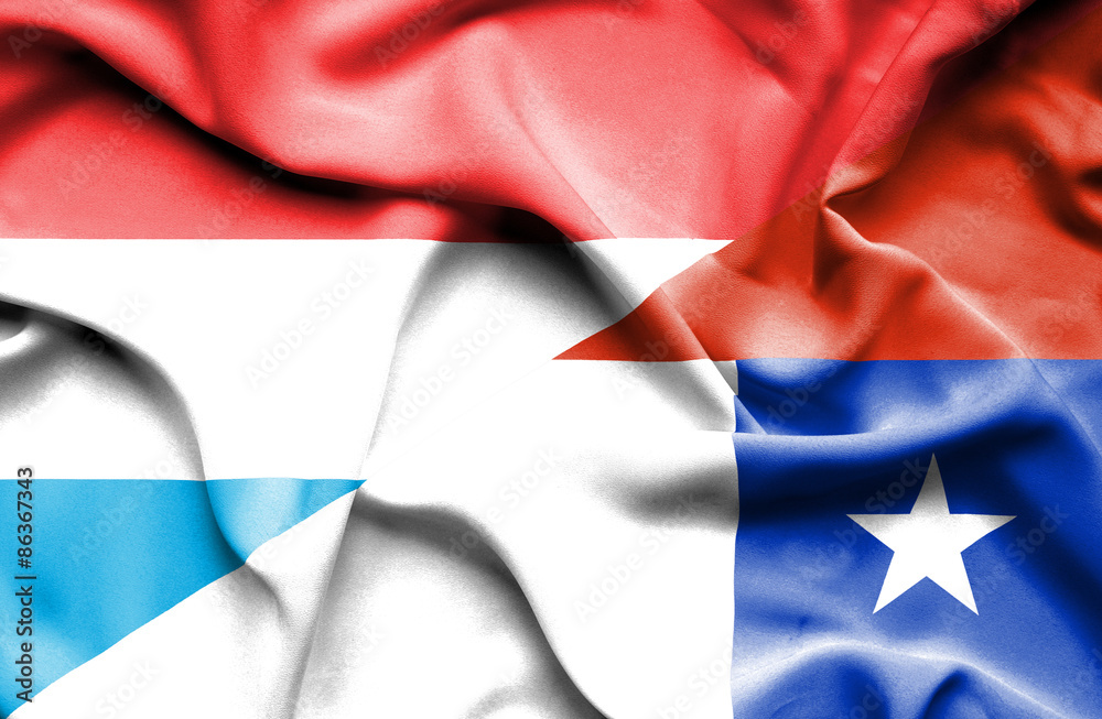 Waving flag of Chile and Luxembourg Waving flag of Chile and Luxembourg