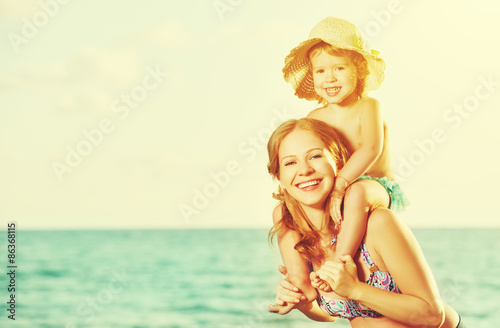 happy family on the beach. mother and baby daughter