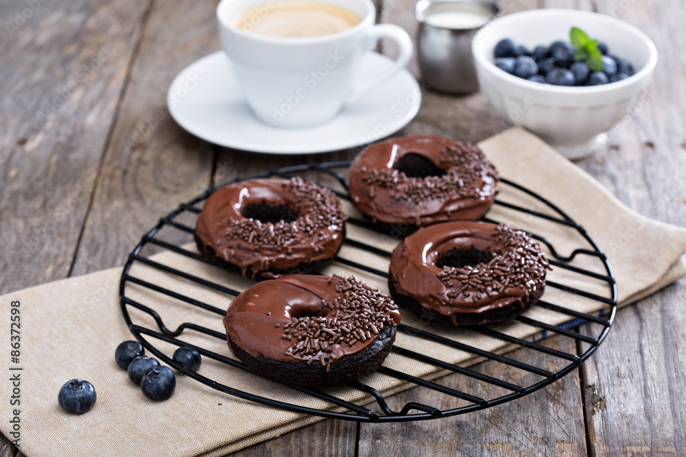 Chocolate donuts with coffee and blueberries Chocolate donuts with coffee and blueberries
