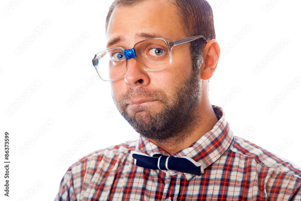 portrait of sad hipster guy in glasses and bowtie portrait of sad hipster guy in glasses and bowtie