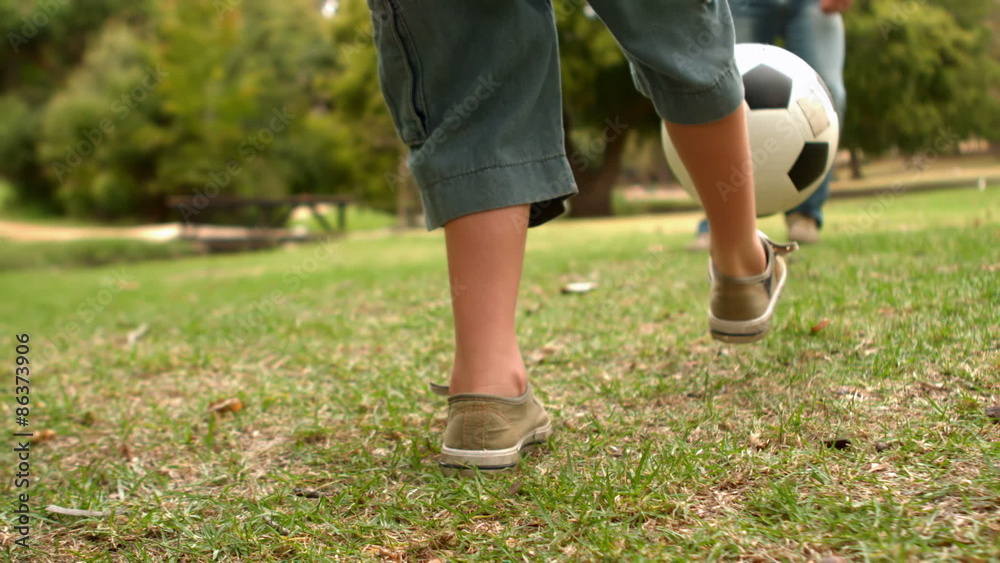 Happy father with his son playing at the ball