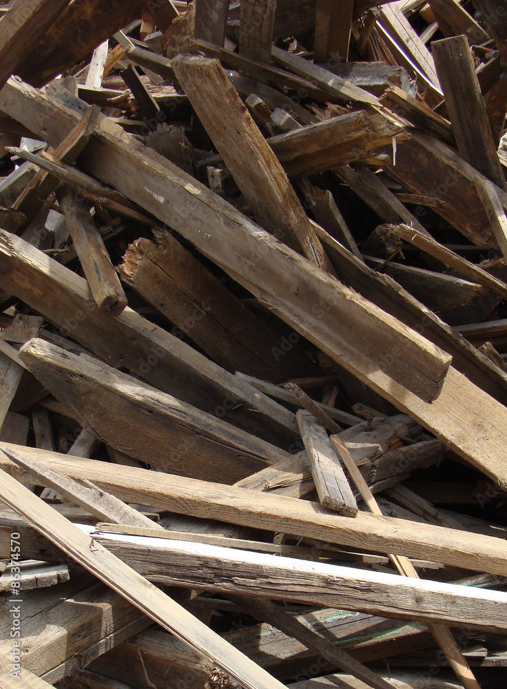 large stack of wood on a demolition site