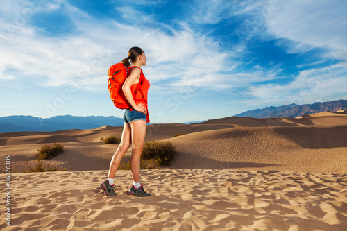 Woman with rucksack standing in Death valley 