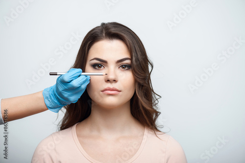 Cheerful young girl is preparing for meeting