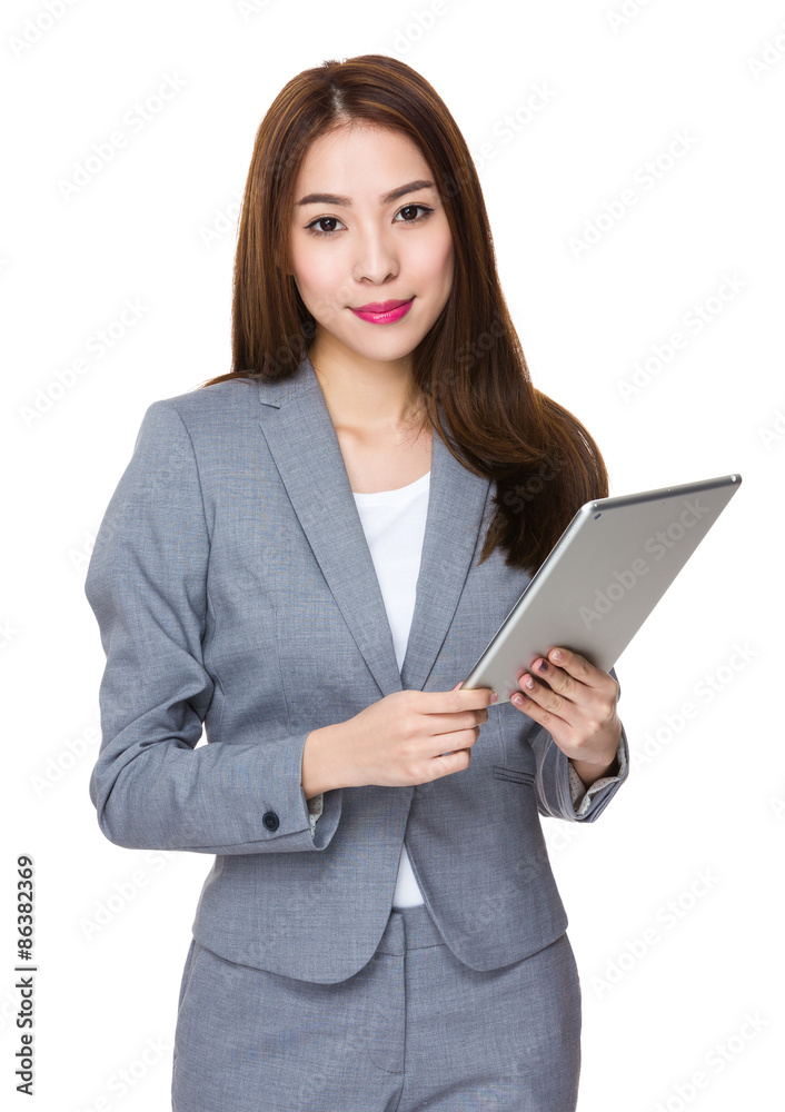 Asian Businesswoman use of the digital tablet Asian Businesswoman use of the digital tablet
