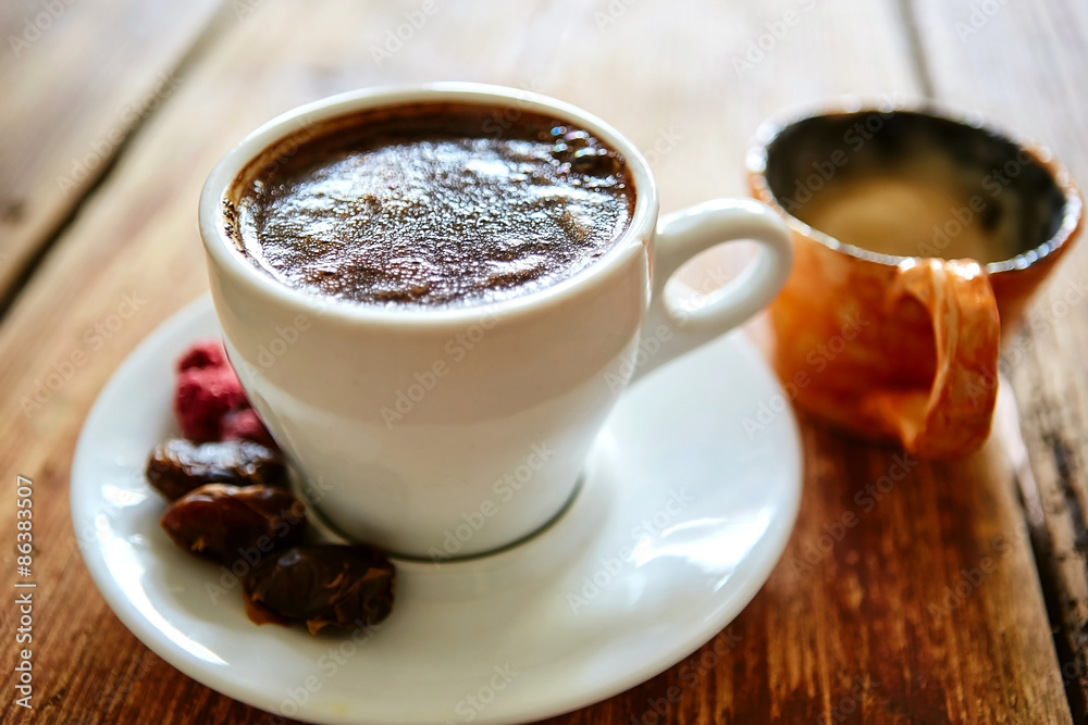 Cup of coffee on a wooden background Cup of coffee on a wooden background