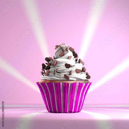 Delicious cupcake with chocolate hearts on a whipped cream. Vintage background.