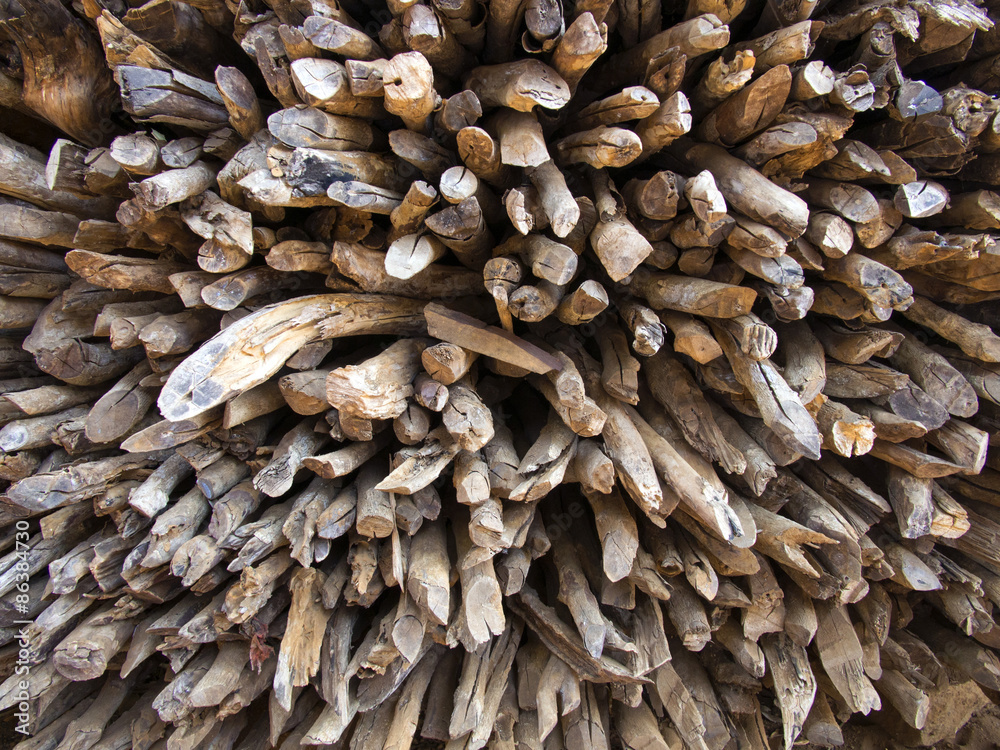 The pile of firewood were taken close up and fill the whole picture. The picture can be use as  wall paper or background image as the beauty texture and composition are good looking..