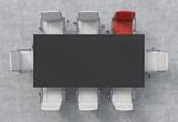 Top View of a conference room. A black rectangular table and eight chairs around, one of them is red. Office interior. 3D rendering.