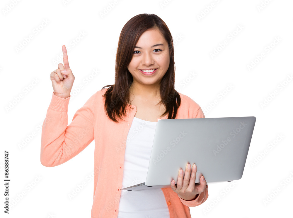 Woman holding with laptop computer and finger point up Woman holding with laptop computer and finger point up