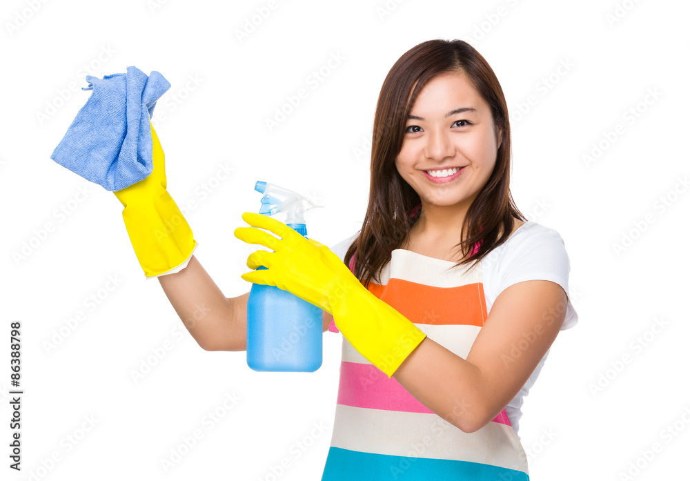 Housewife cleaning using the rag and bottle spray Housewife cleaning using the rag and bottle spray